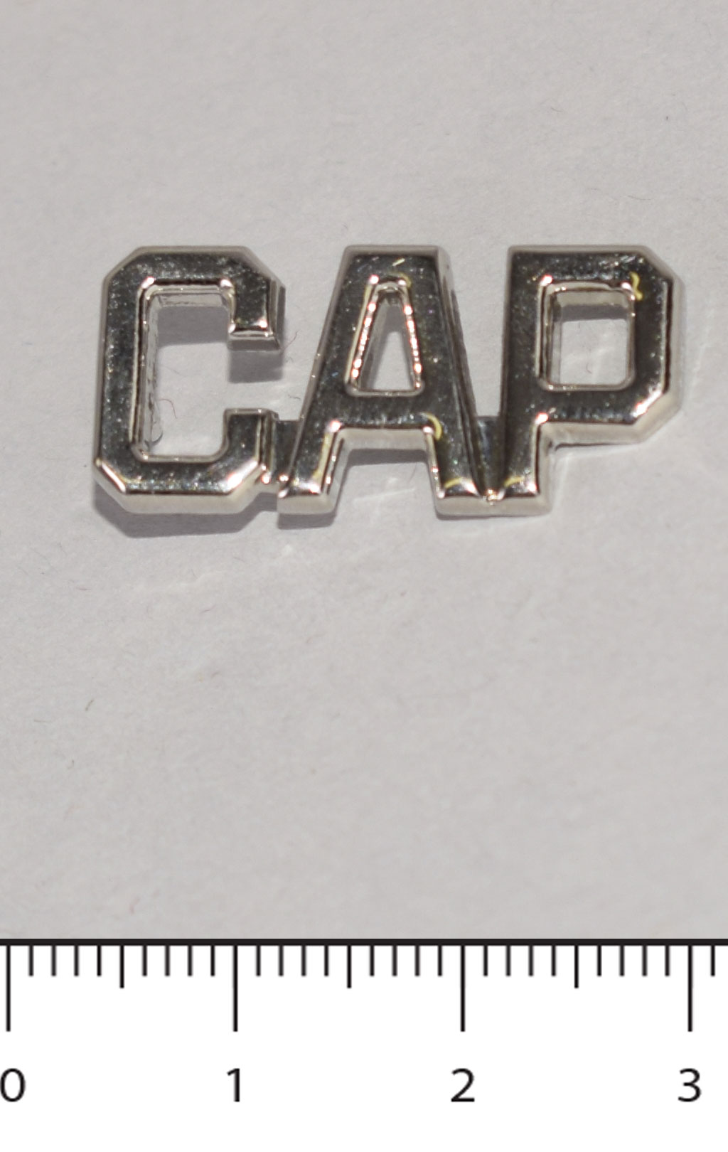 Знак CAP silver 